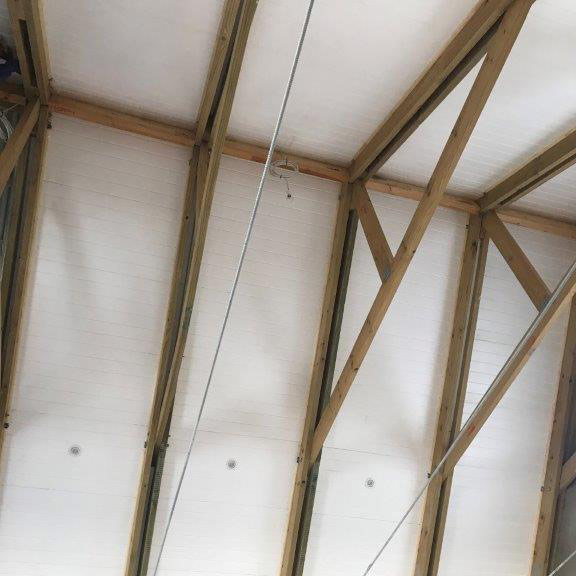 Polystyrene Installation over Exposed Trusses | Thermaboards